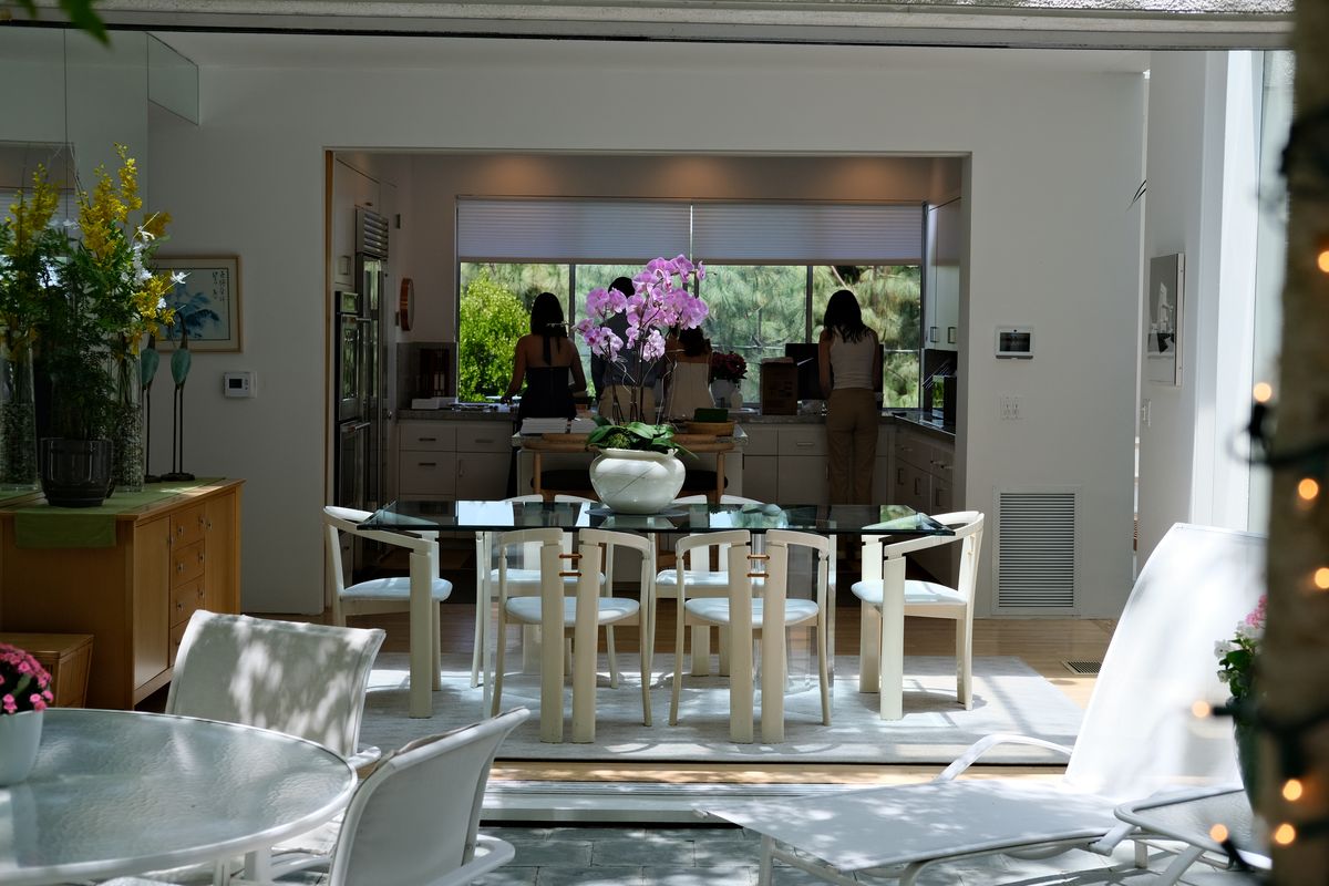 An elegant dining room set for a party, flowers on the table