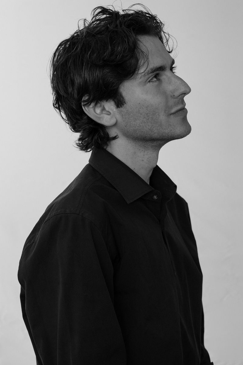 Black-and-white profile portrait of a man looking to the side